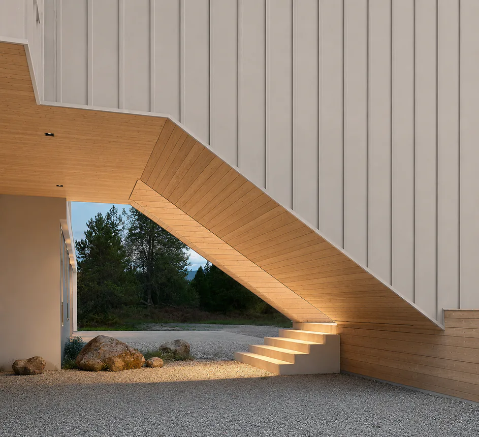Asker facade detail with warm timber soffit and evening exterior lighting